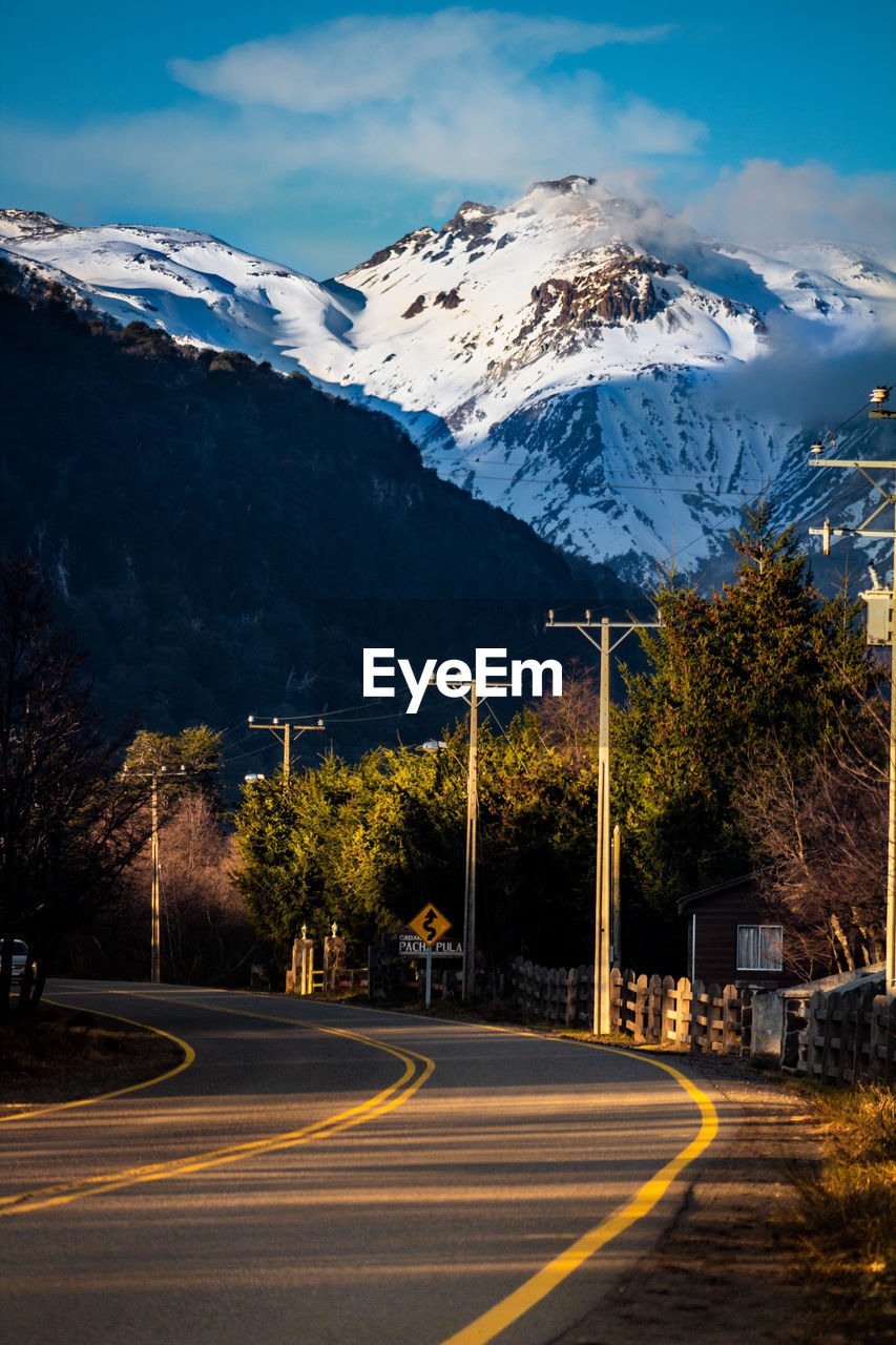 Road against snowcapped mountains