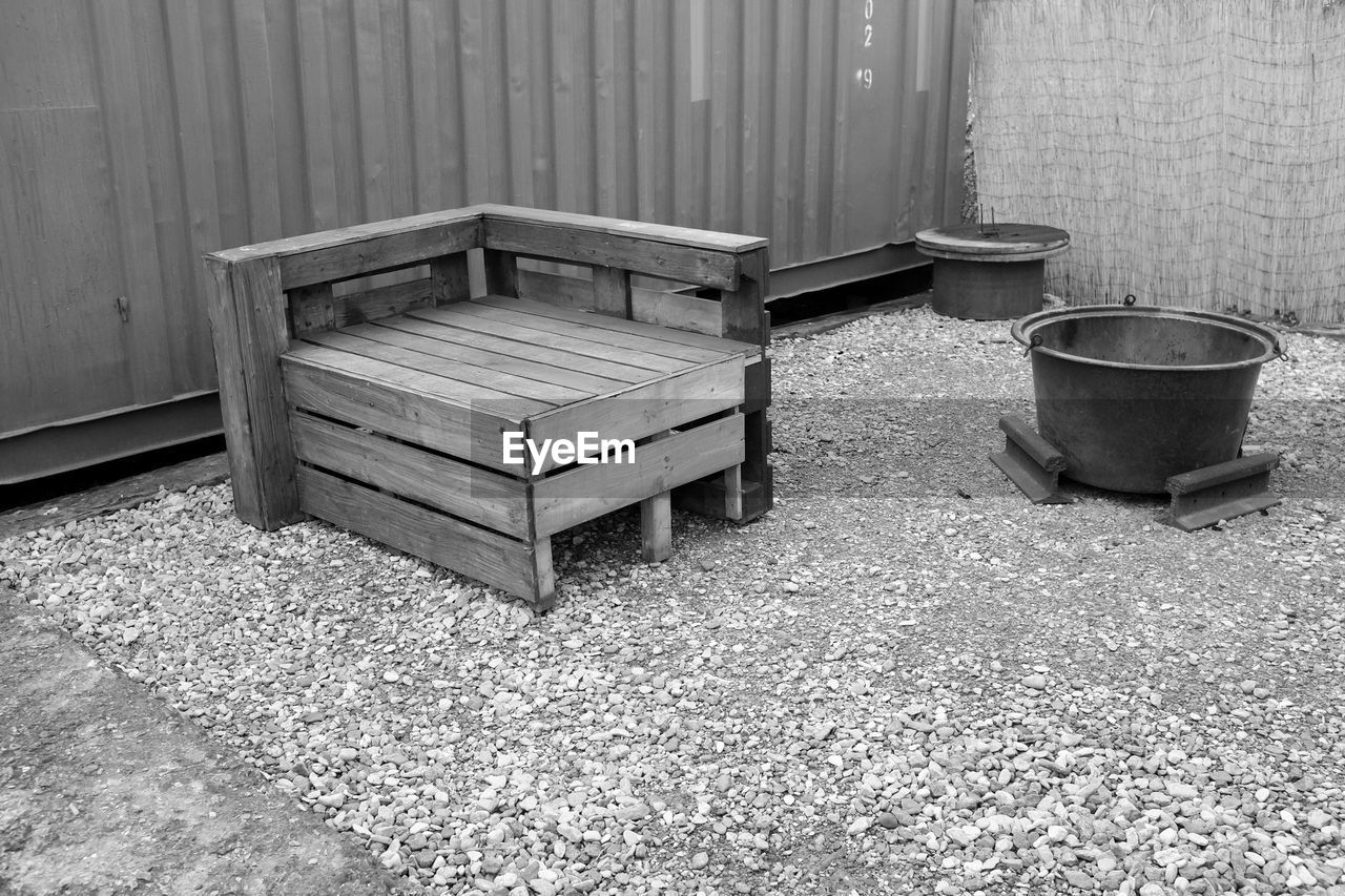 HIGH ANGLE VIEW OF EMPTY BENCHES ON ROAD