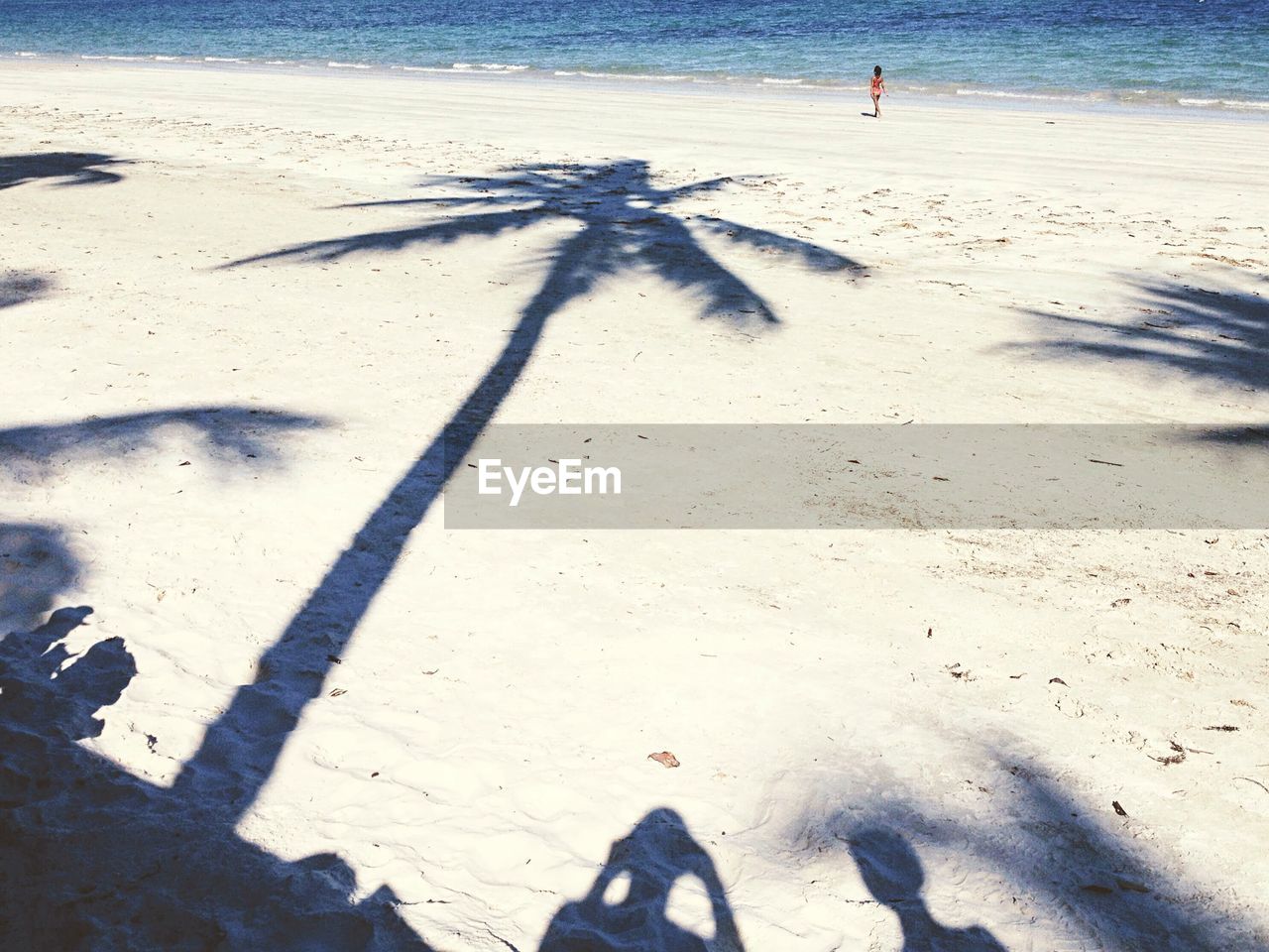 High angle view of shadow on sand at beach