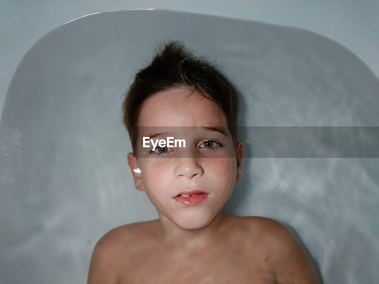 Close-up portrait of shirtless boy