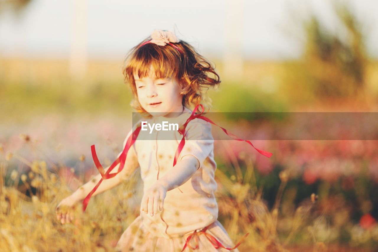 Girl standing on land