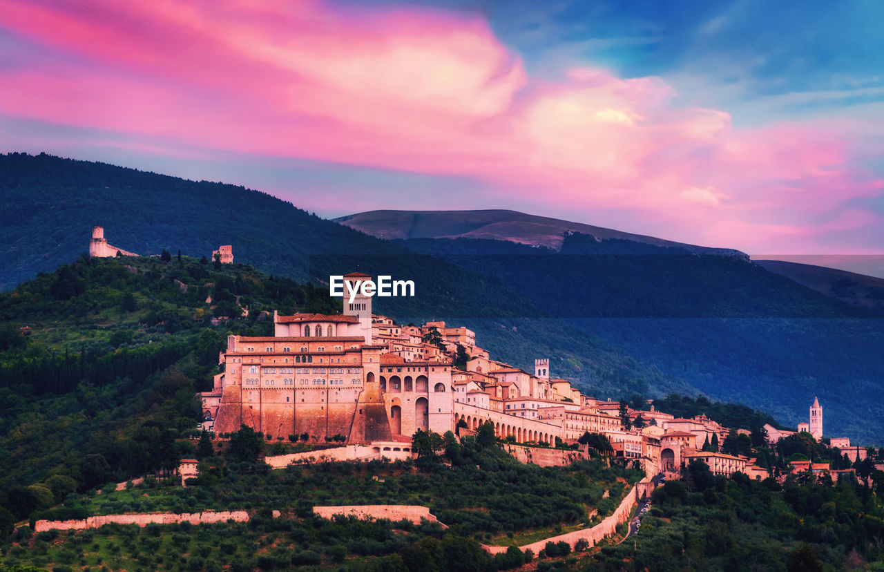 Panoramic views of the magnificent sunset city of assisi.