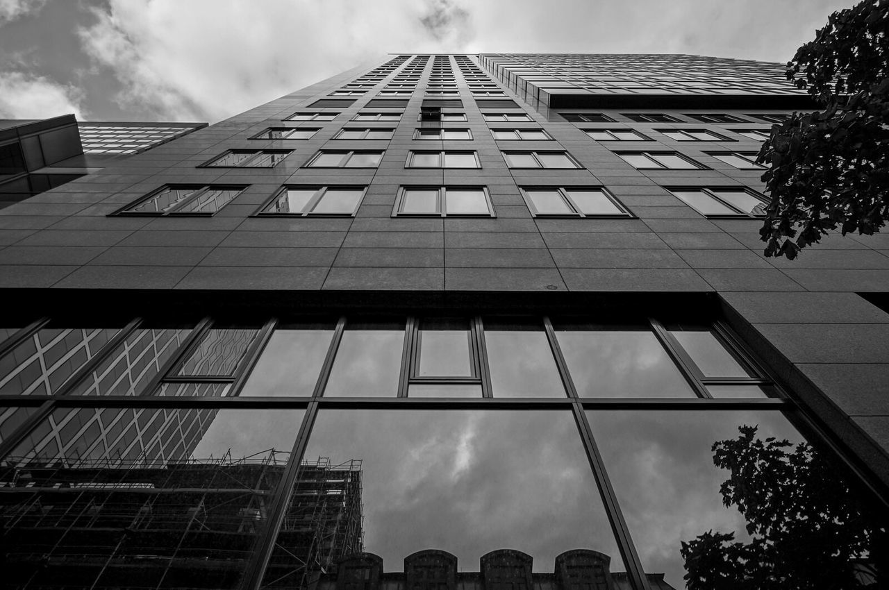 LOW ANGLE VIEW OF MODERN BUILDINGS AGAINST SKY