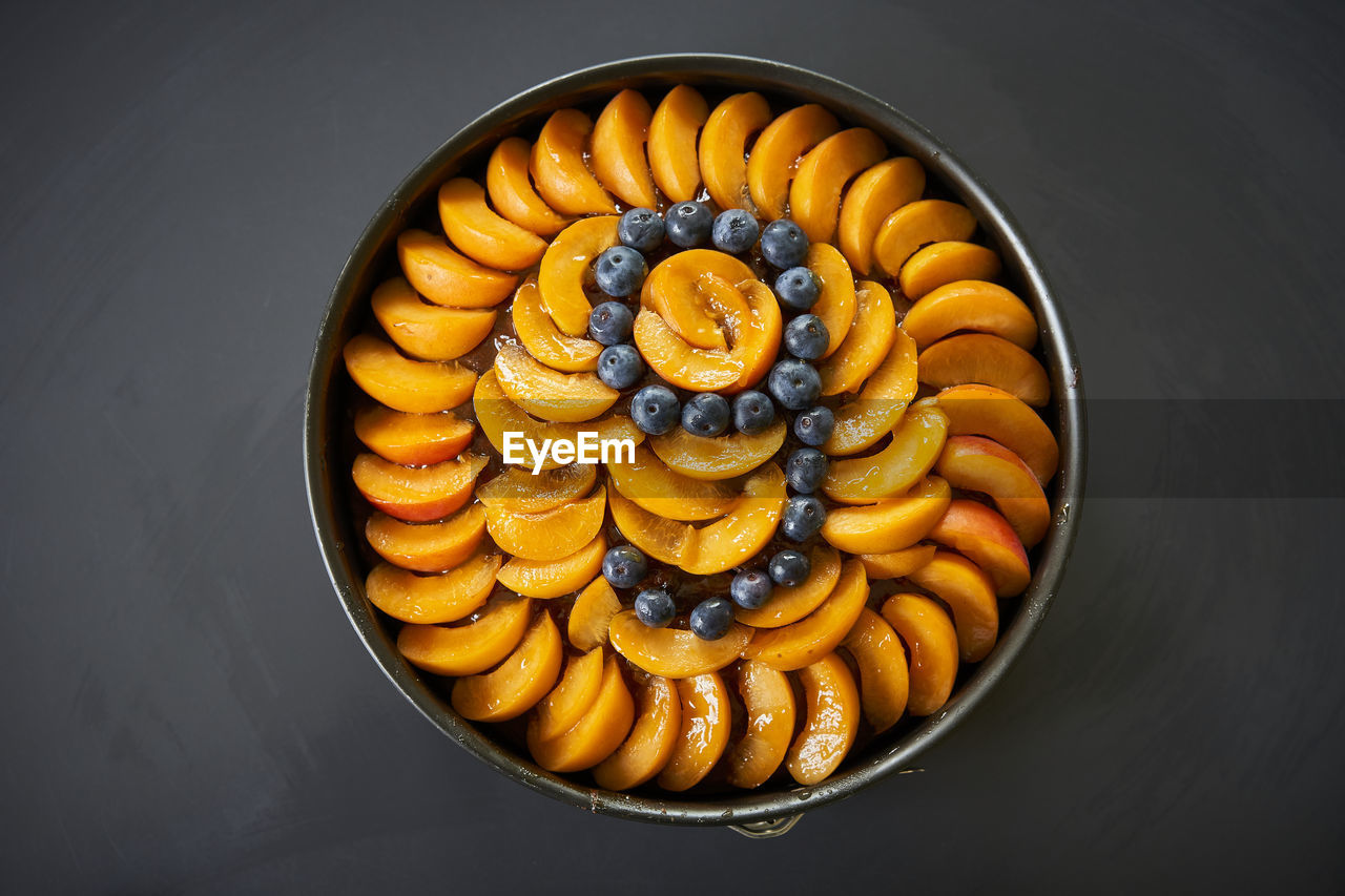 Directly above shot of birthday cake on table against black background