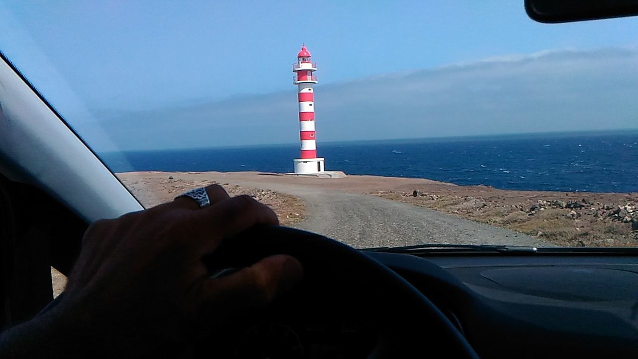 CROPPED IMAGE OF PERSON ON SEA