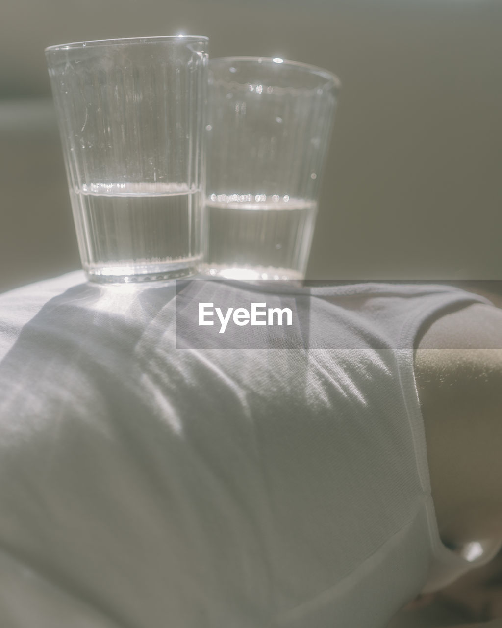 CLOSE-UP OF EMPTY GLASS WITH WATER