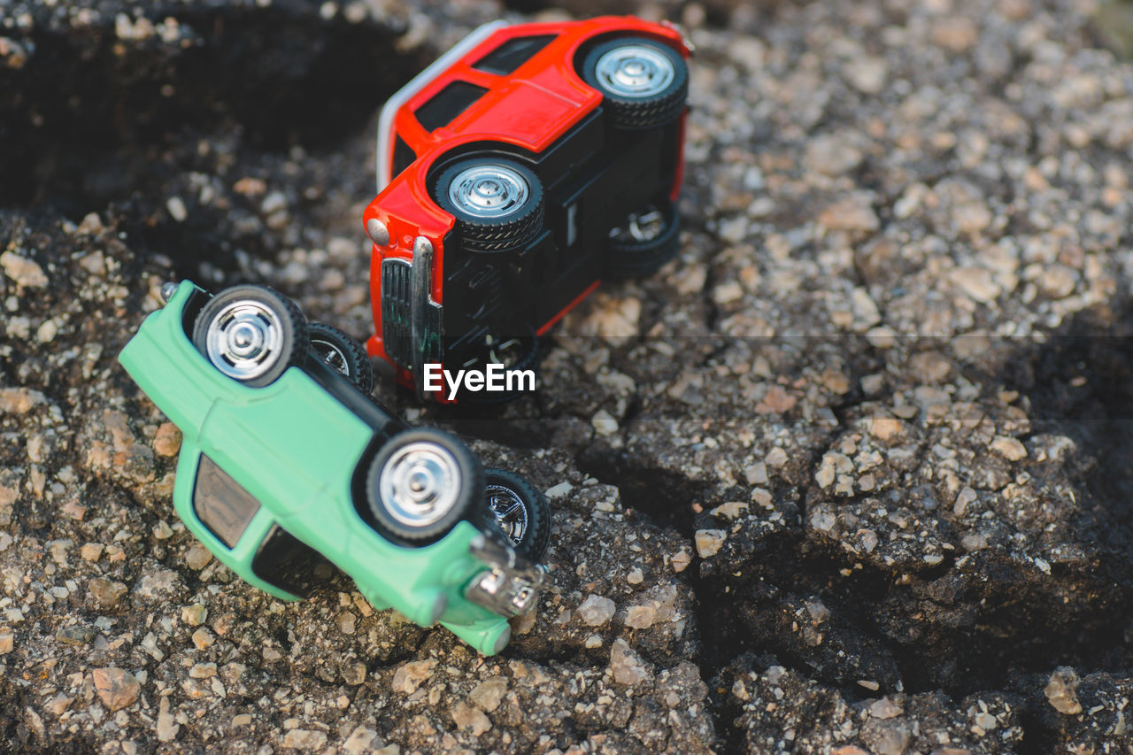 HIGH ANGLE VIEW OF TOY CAR ON CAMERA