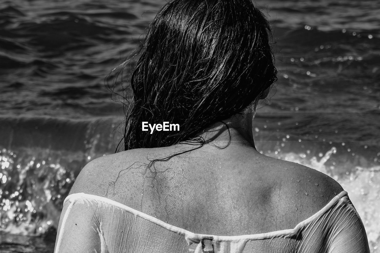 Rear view of woman in water