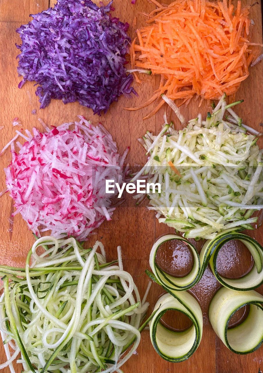 HIGH ANGLE VIEW OF CHOPPED VEGETABLES ON TABLE