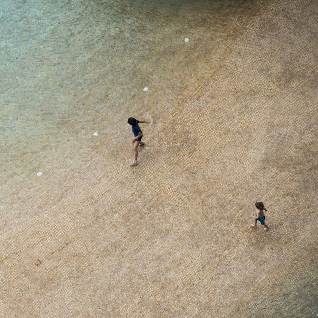High angle view of two kids playing on beach