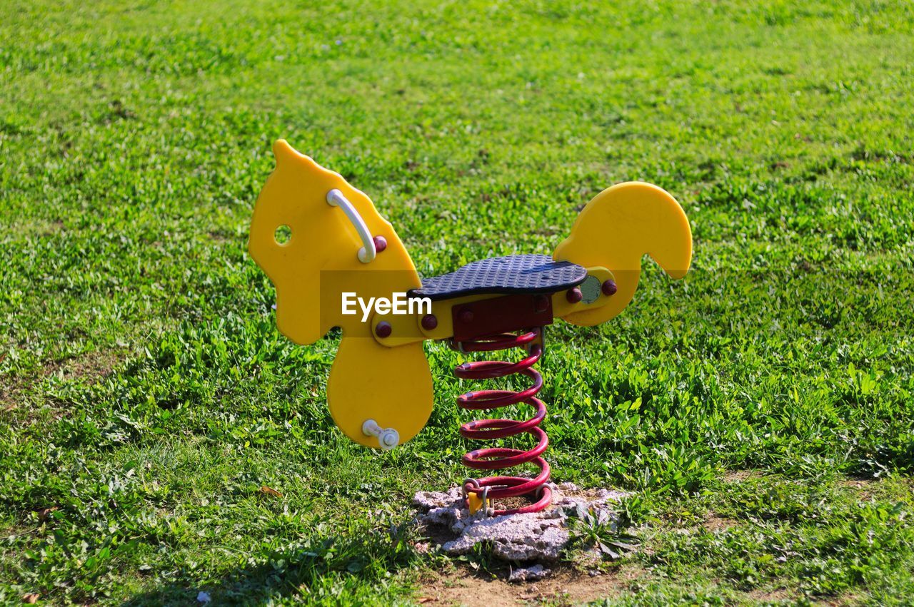 CLOSE-UP OF TOY ON PLAYGROUND