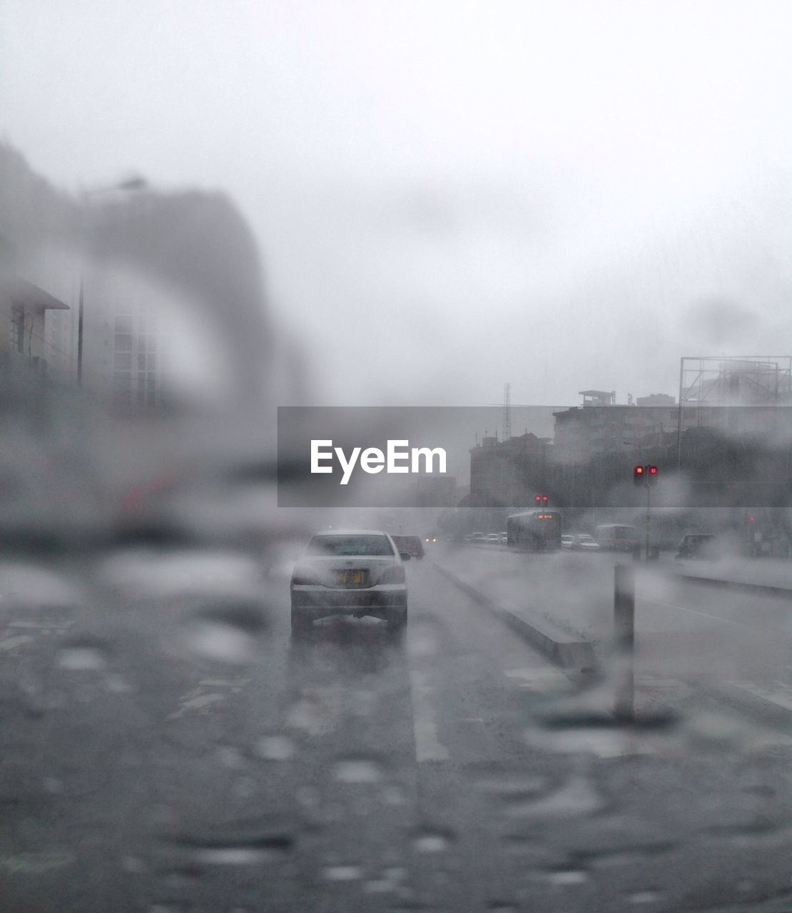 CARS ON ROAD IN RAIN