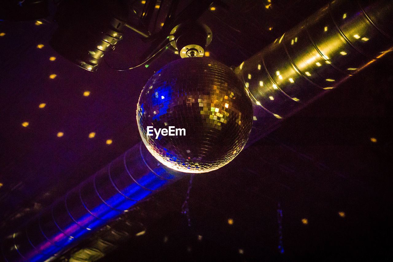 Low angle view of disco ball at nightclub