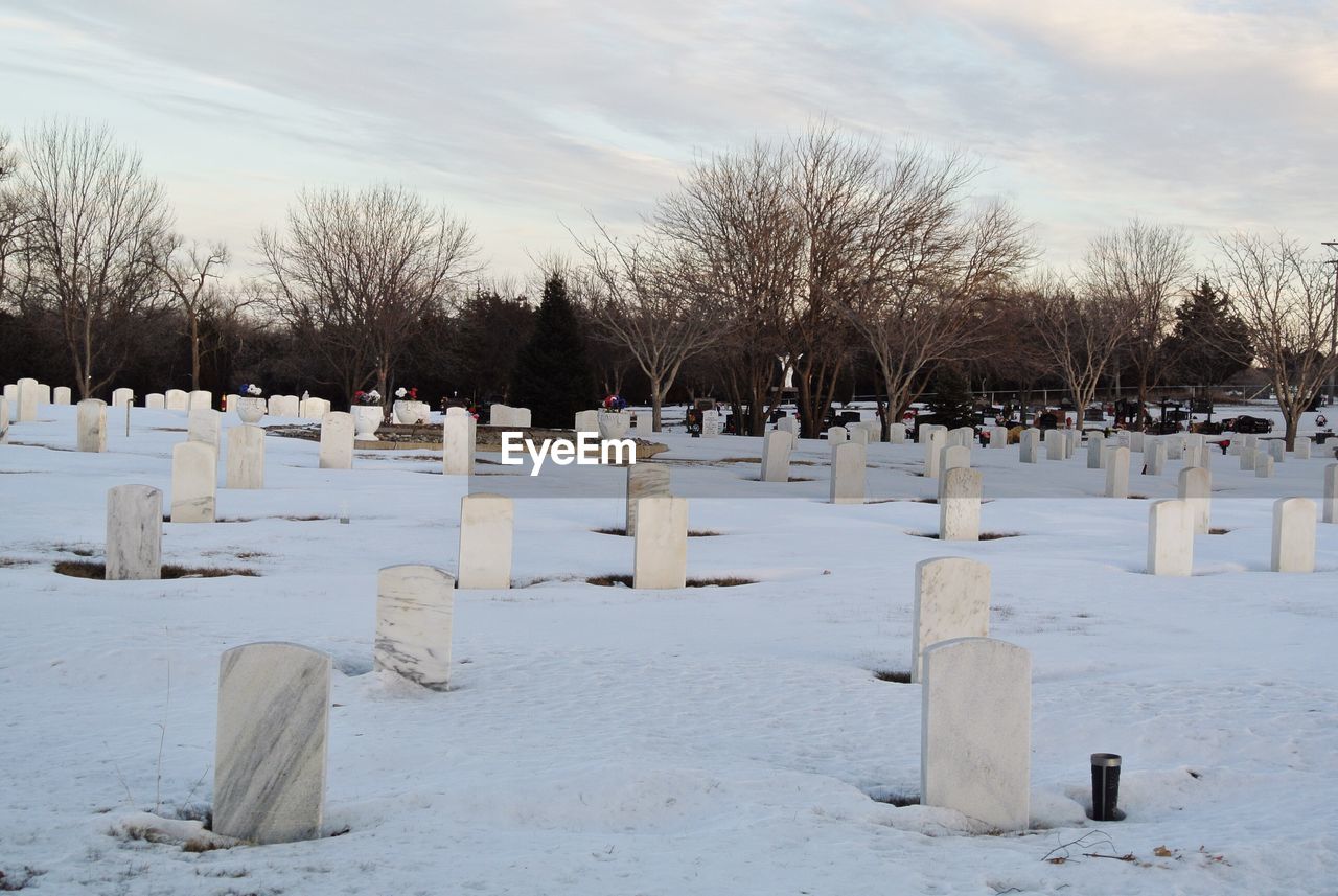 View of cemetery against sky during winter