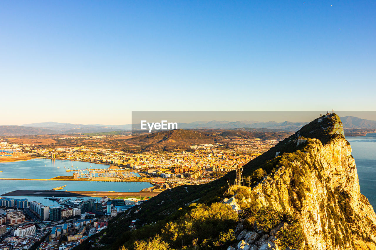 HIGH ANGLE VIEW OF TOWNSCAPE AGAINST CLEAR SKY