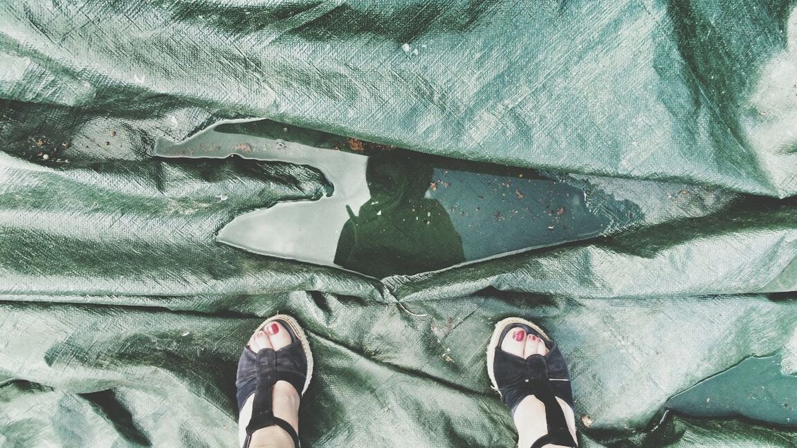 Low section of woman standing on plastic surface