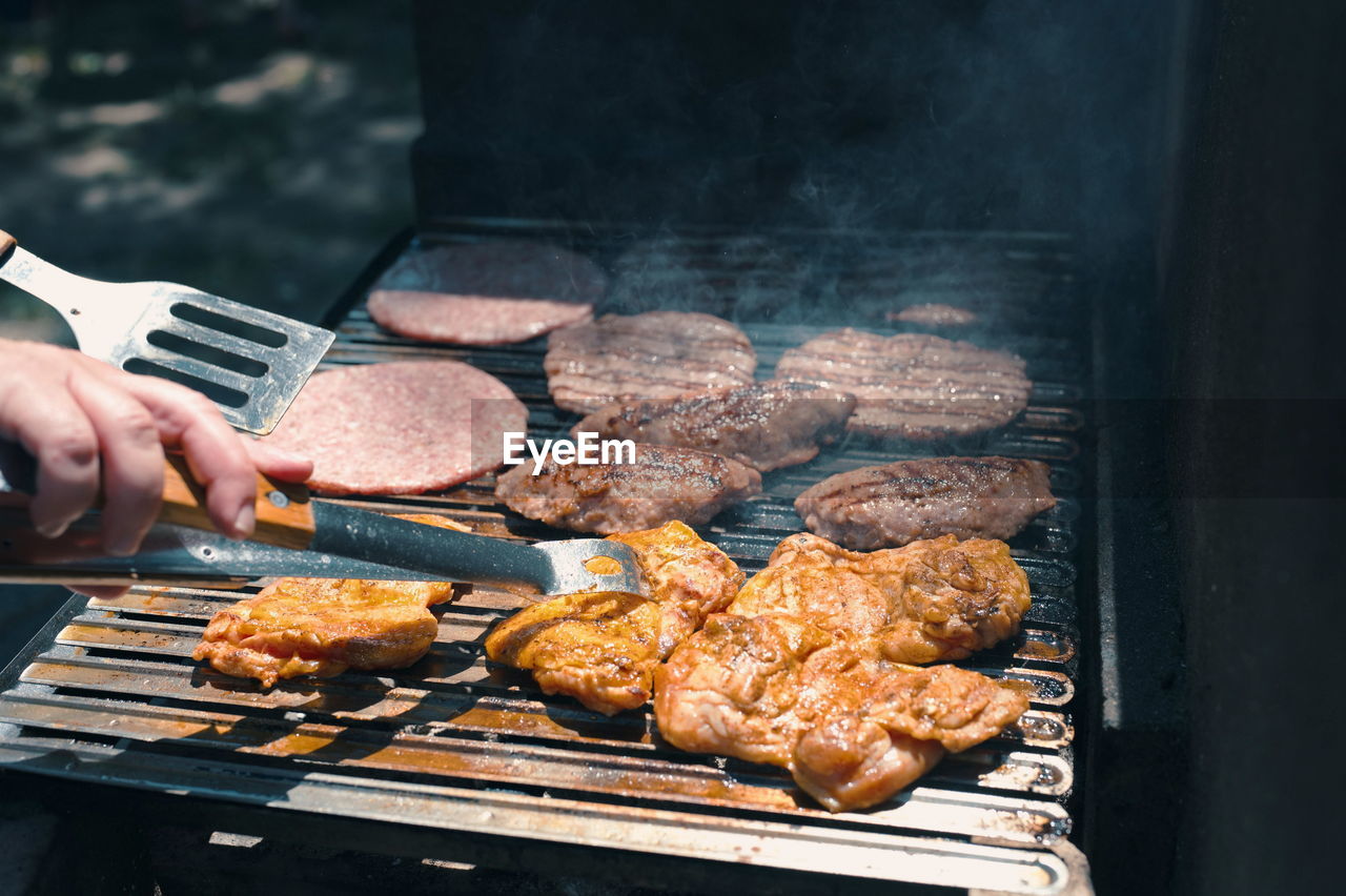 Assorted delicious grilled meat on barbecue