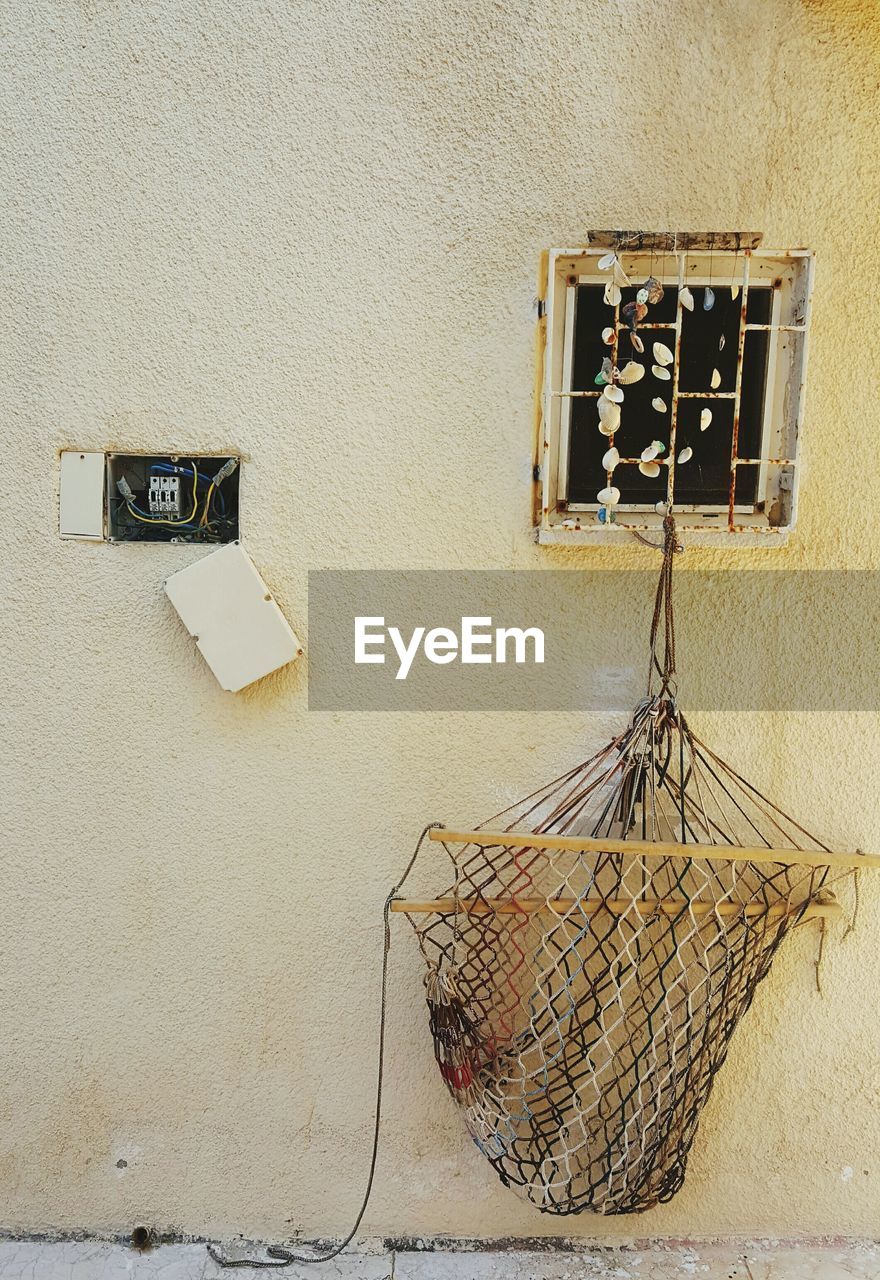 VIEW OF TELEPHONE BOOTH AGAINST WALL