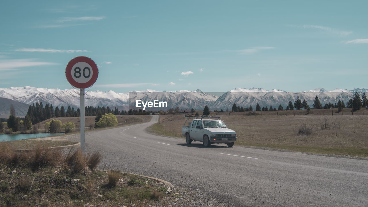 View of road sign against sky