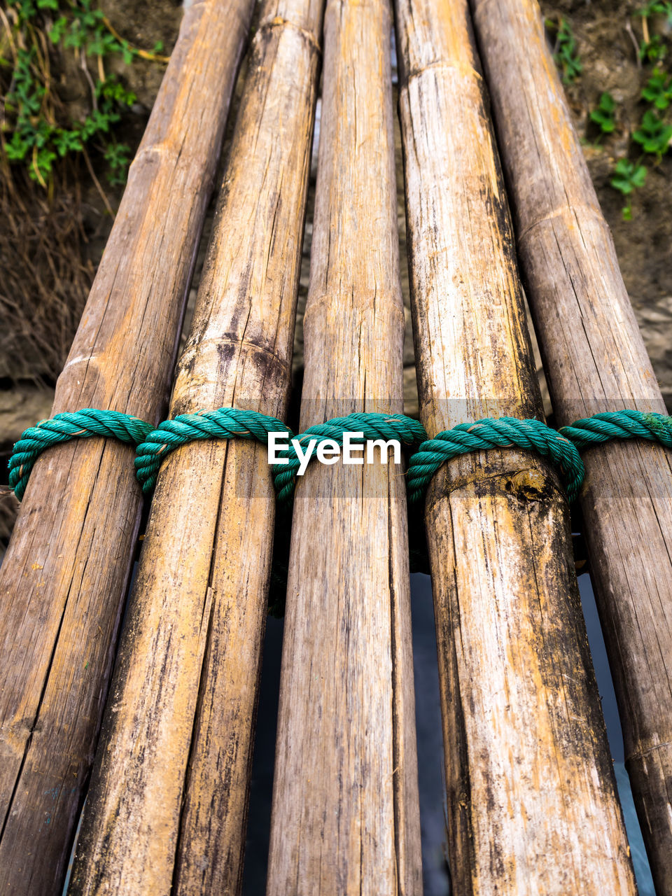 Dried bamboo tie with green nylon rope as a small bridge