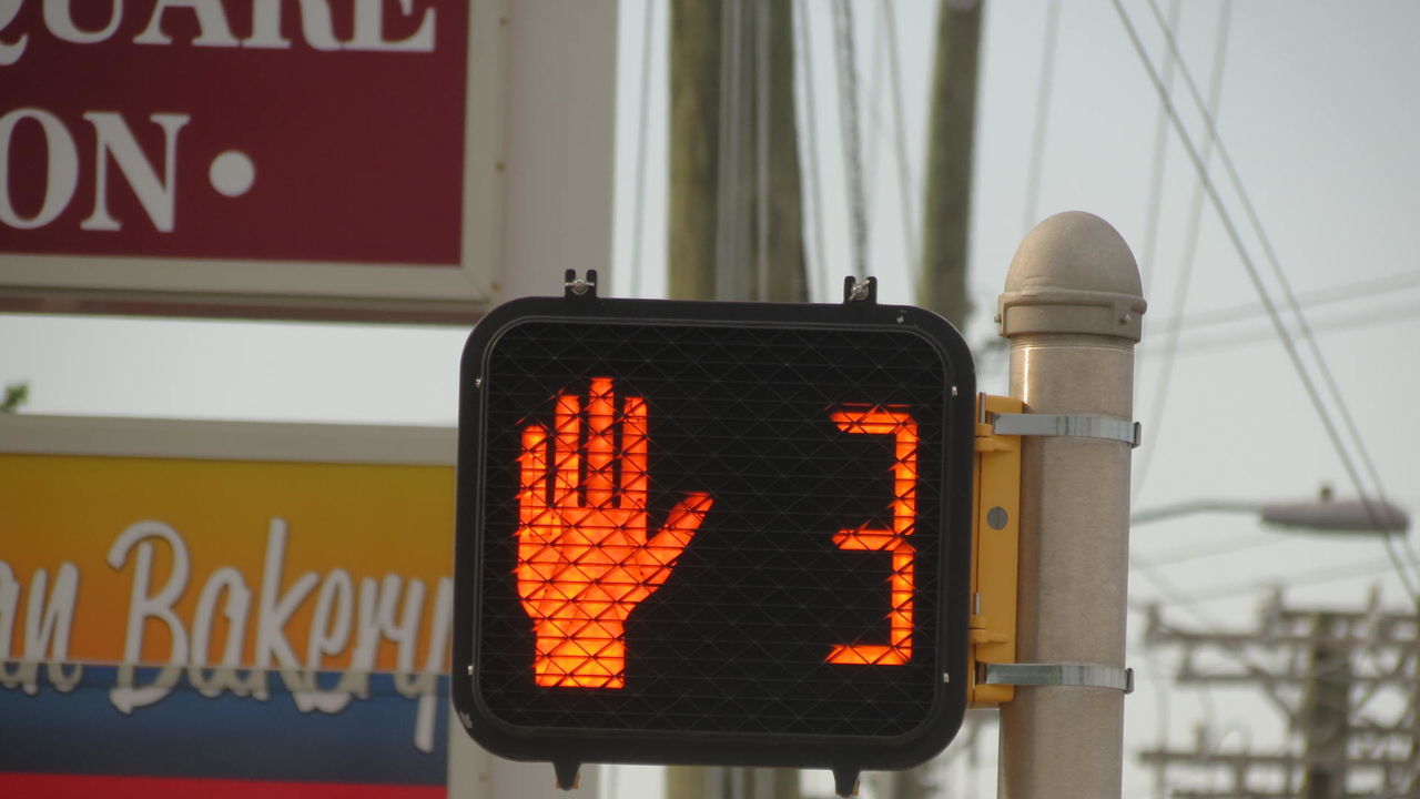 LOW ANGLE VIEW OF ROAD SIGNS