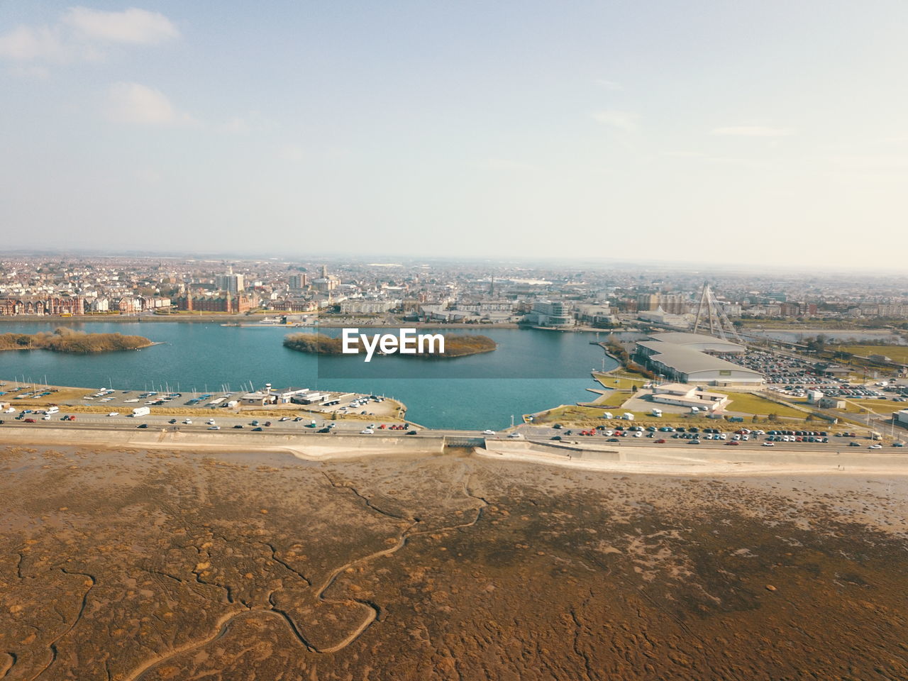 Scenic view of sea and city against sky