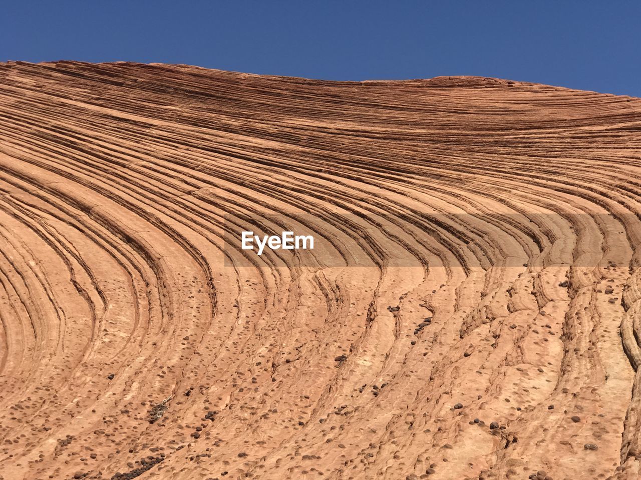 Scenic view of desert against clear sky