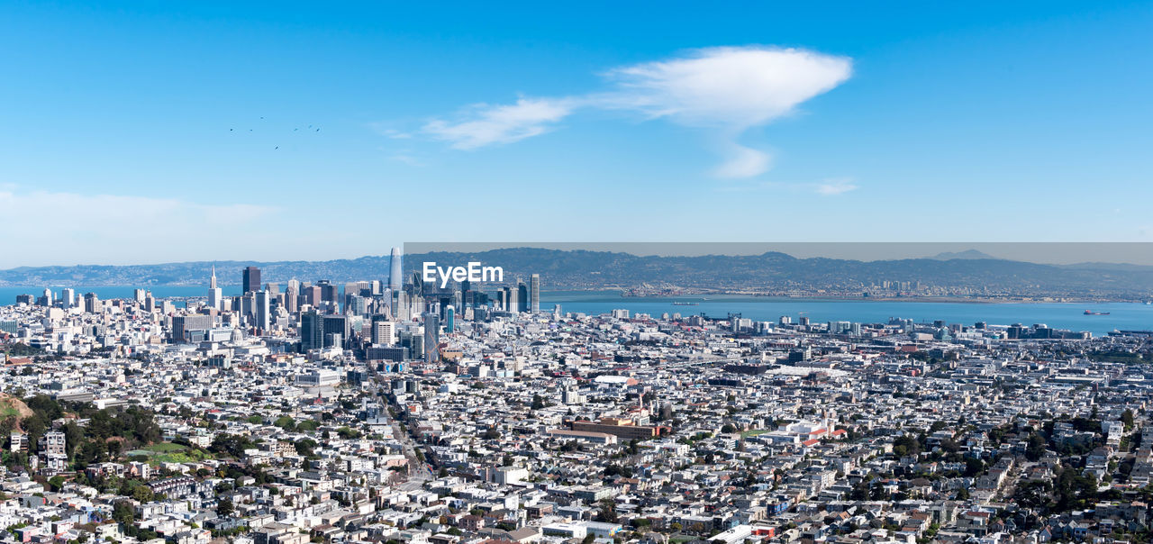 HIGH ANGLE VIEW OF BUILDINGS AGAINST SKY