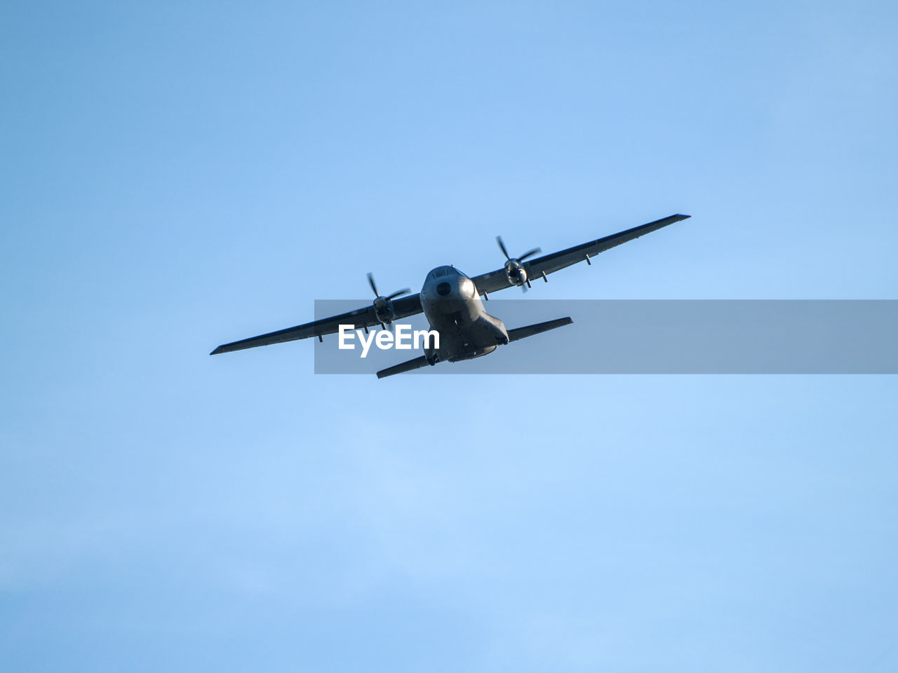 LOW ANGLE VIEW OF AIRPLANE AGAINST SKY