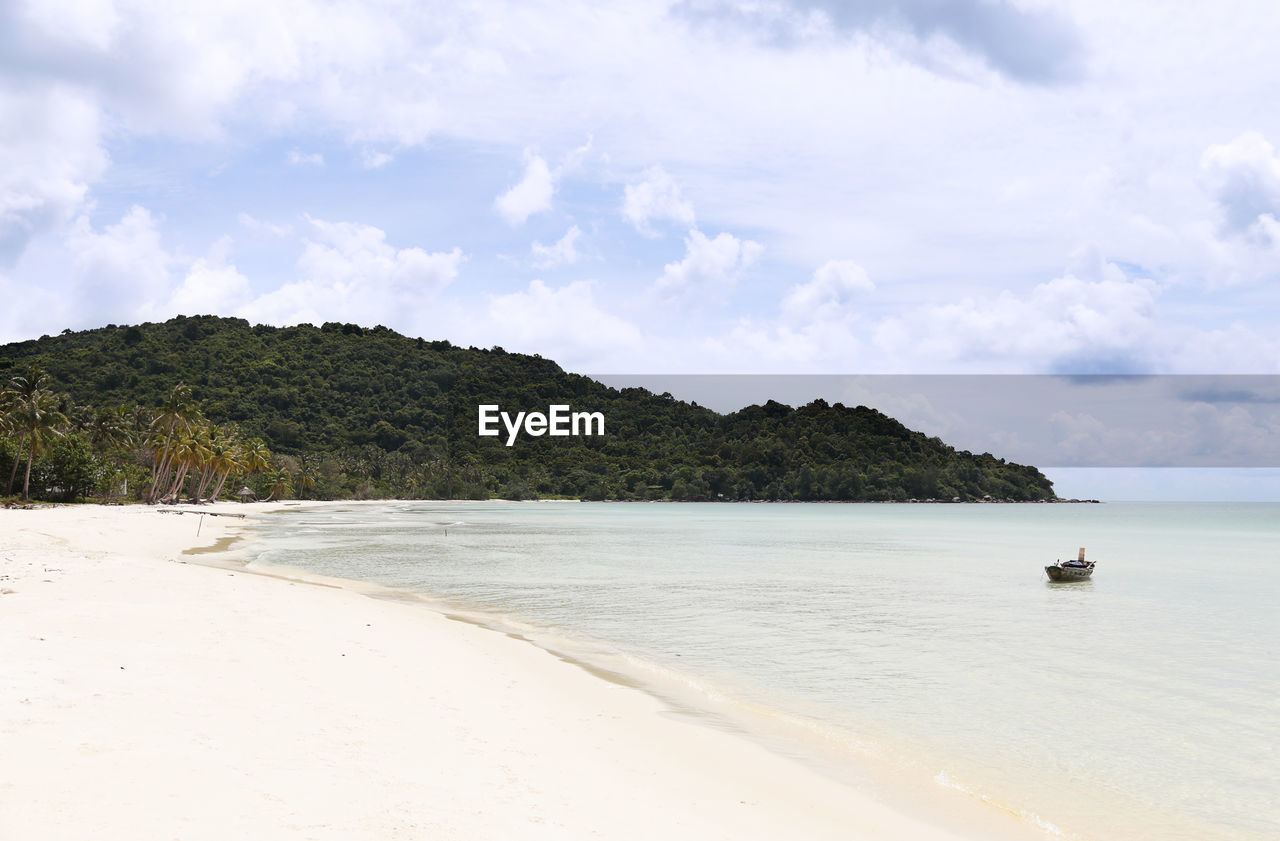 View of calm beach against the sky