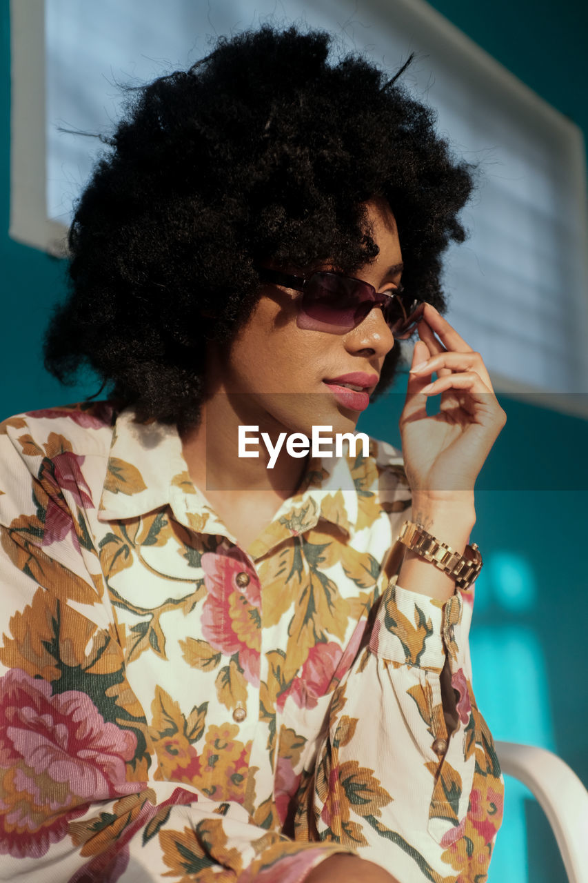Fashionable afro woman at home