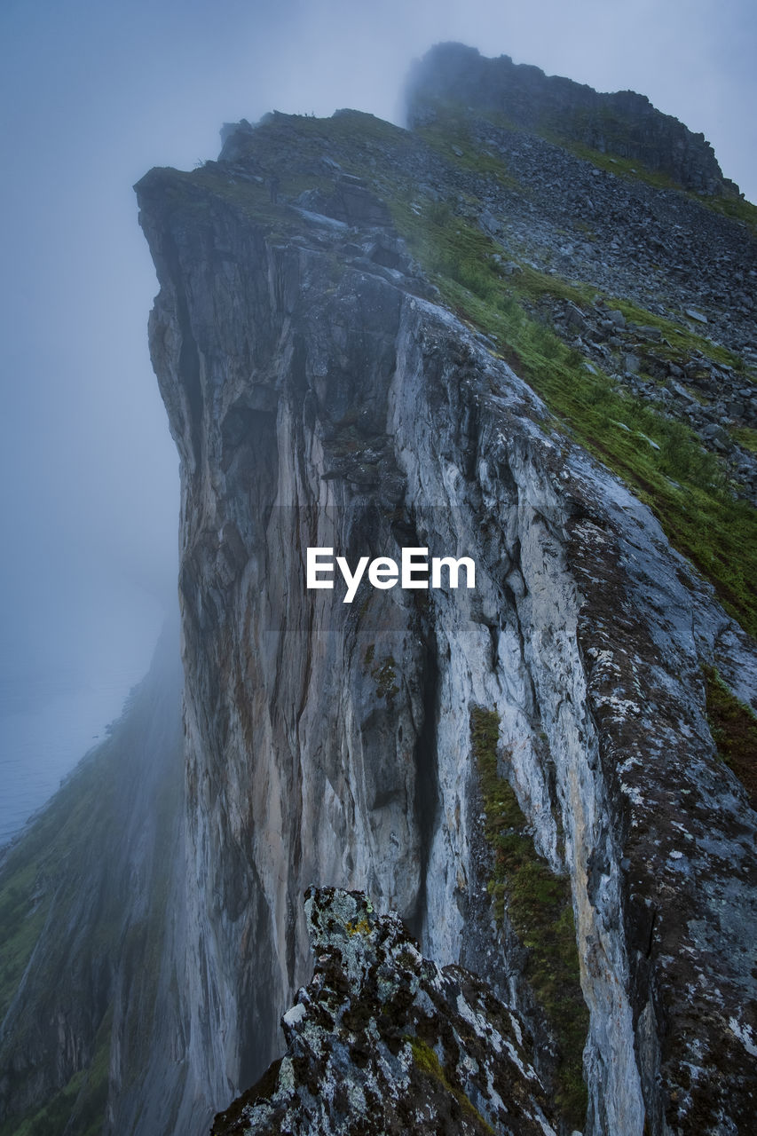 Scenic view of waterfall against sky