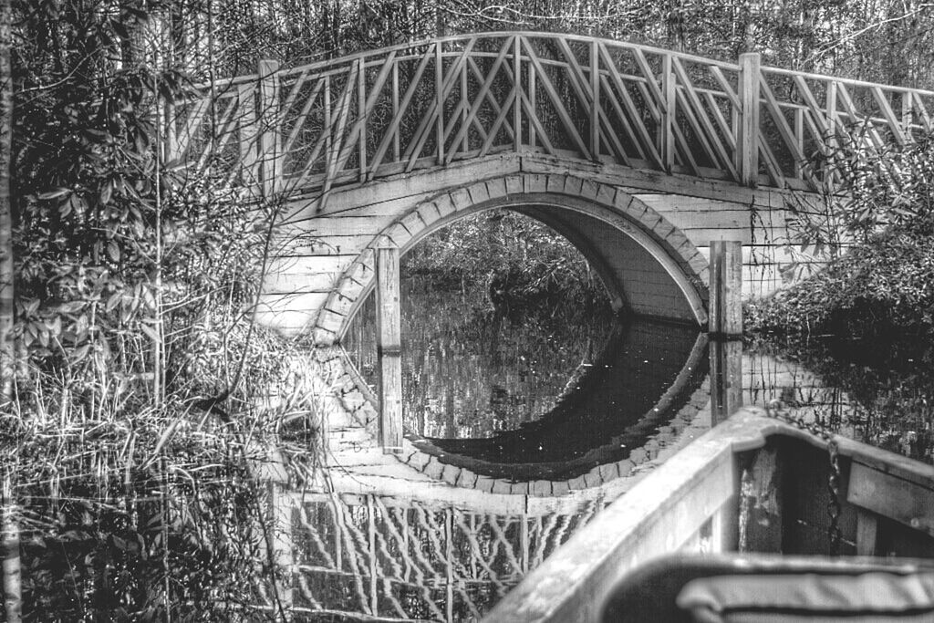 VIEW OF BUILT STRUCTURE WITH TREES IN FOREGROUND