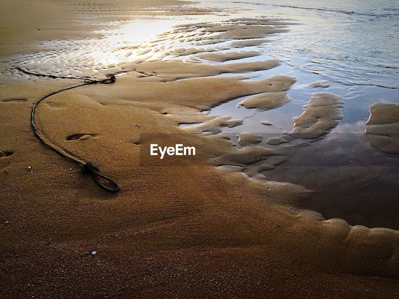 Scenic view of beach against sky during sunset