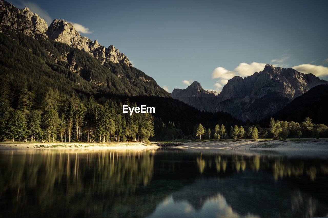 Scenic view of lake and mountains against sky