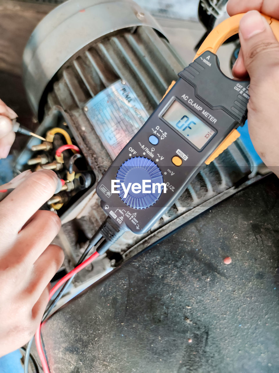 MIDSECTION OF PERSON WORKING ON MACHINE