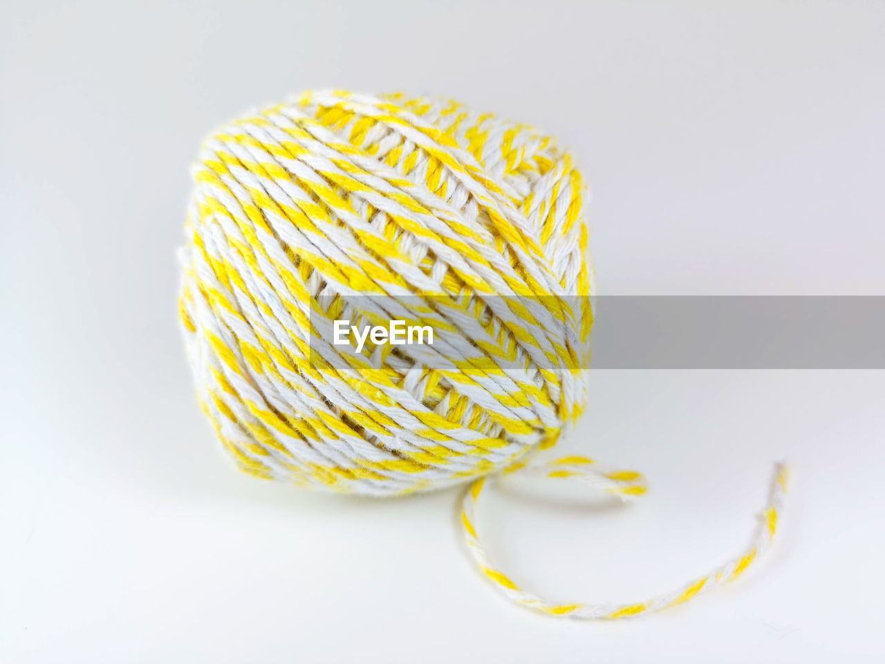 Ball of wool over white background