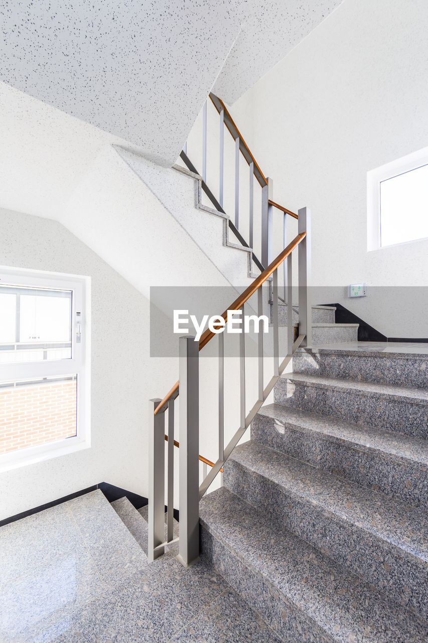 LOW ANGLE VIEW OF SPIRAL STAIRCASE OF BUILDING