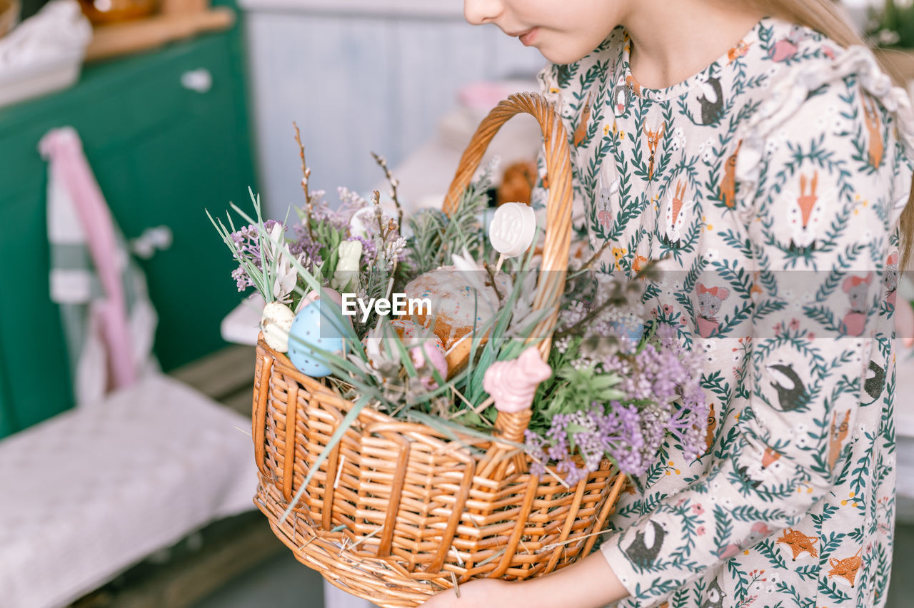 basket, spring, women, picnic basket, one person, adult, flower, flowering plant, plant, container, nature, female, freshness, holding, lifestyles, wicker, floristry, young adult, beauty in nature, outdoors, food and drink, focus on foreground, food, fashion, celebration, bouquet, gift basket, day, clothing, flower arrangement, retail, standing, pattern, business finance and industry, leisure activity, floral pattern, casual clothing, summer