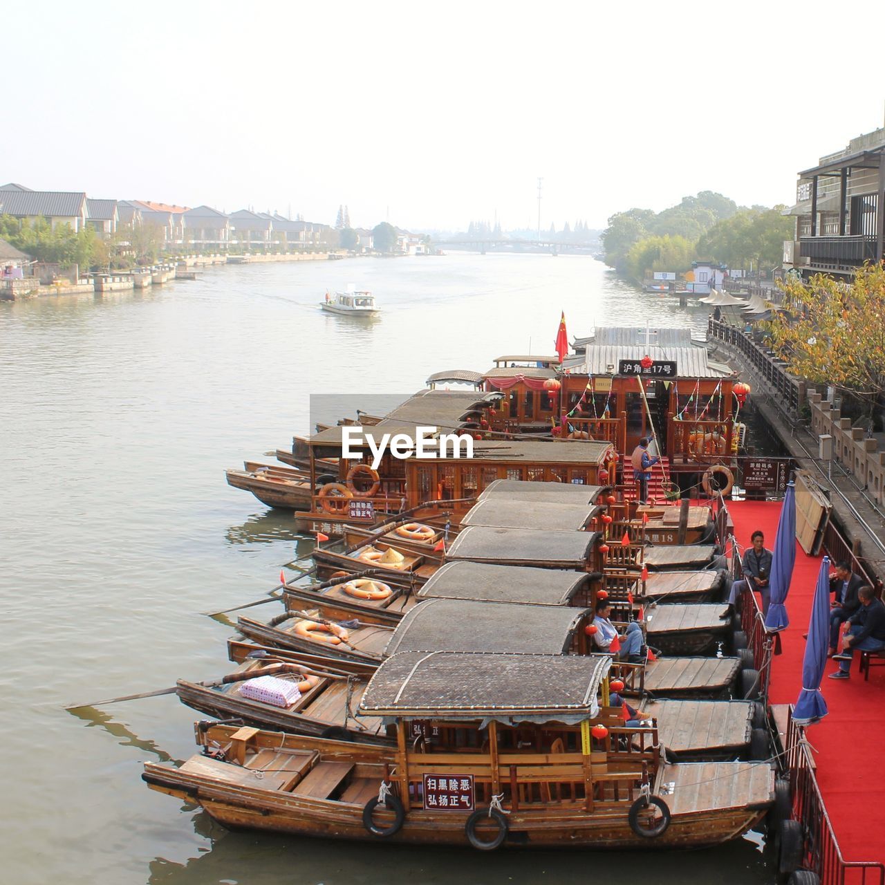 High angle view of harbor by river against sky