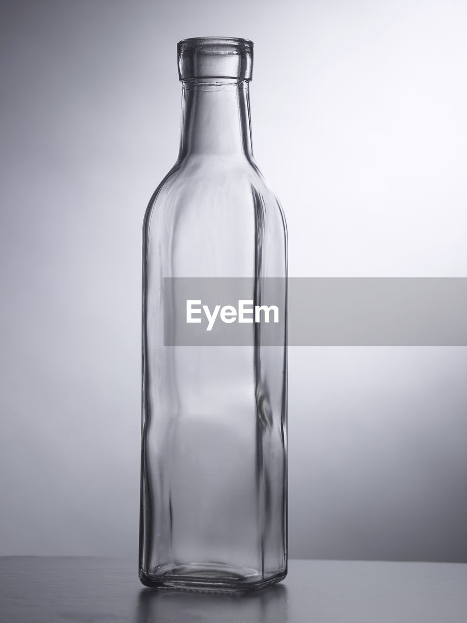 Empty bottle or container on the gray background