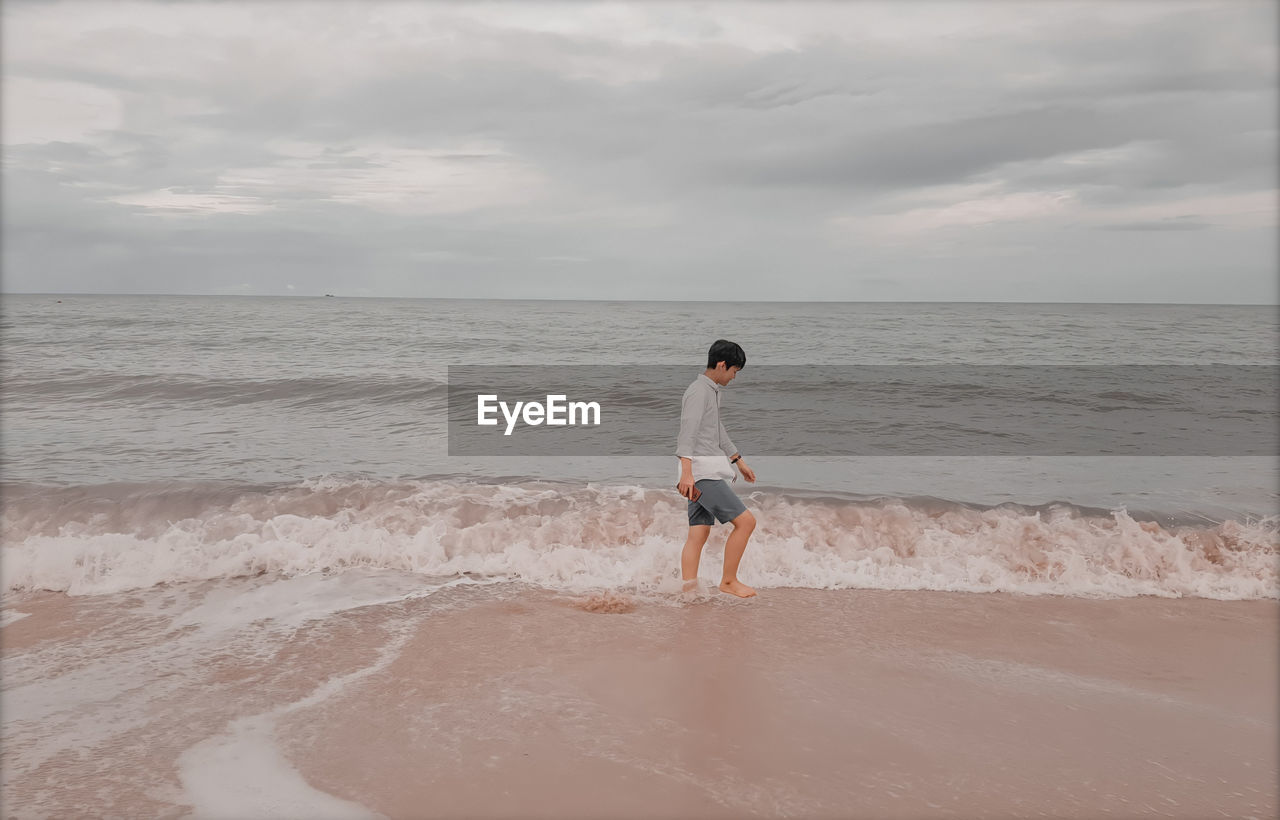 Man walking at beach