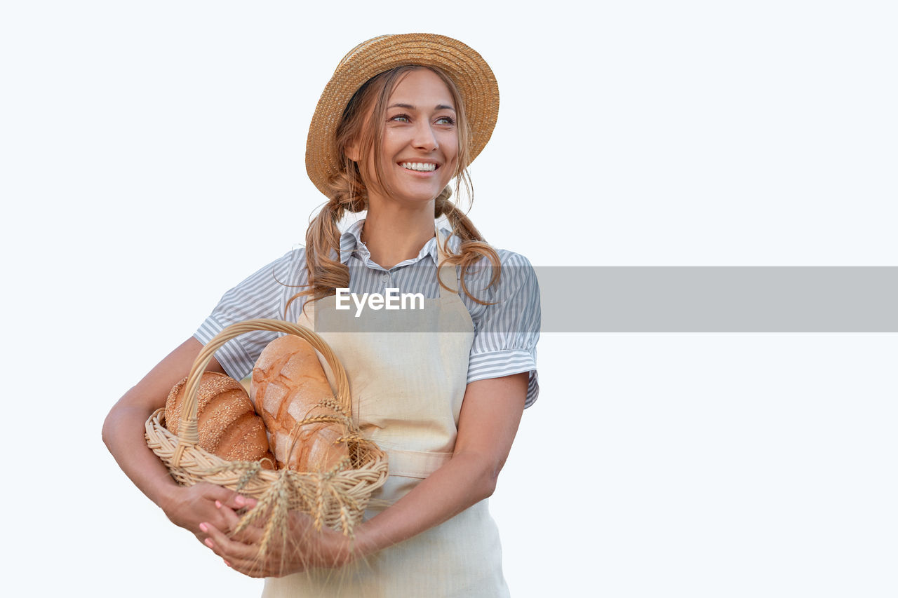 PORTRAIT OF A SMILING YOUNG WOMAN WEARING MASK