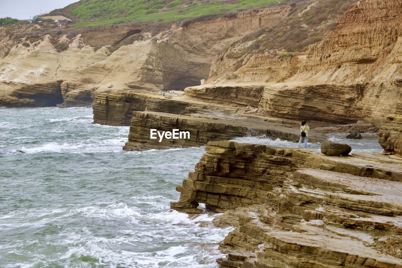 SCENIC VIEW OF ROCK FORMATION AT BEACH