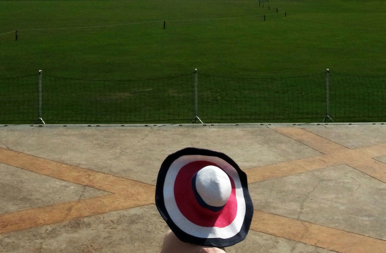 HIGH ANGLE VIEW OF BALL ON GRASS