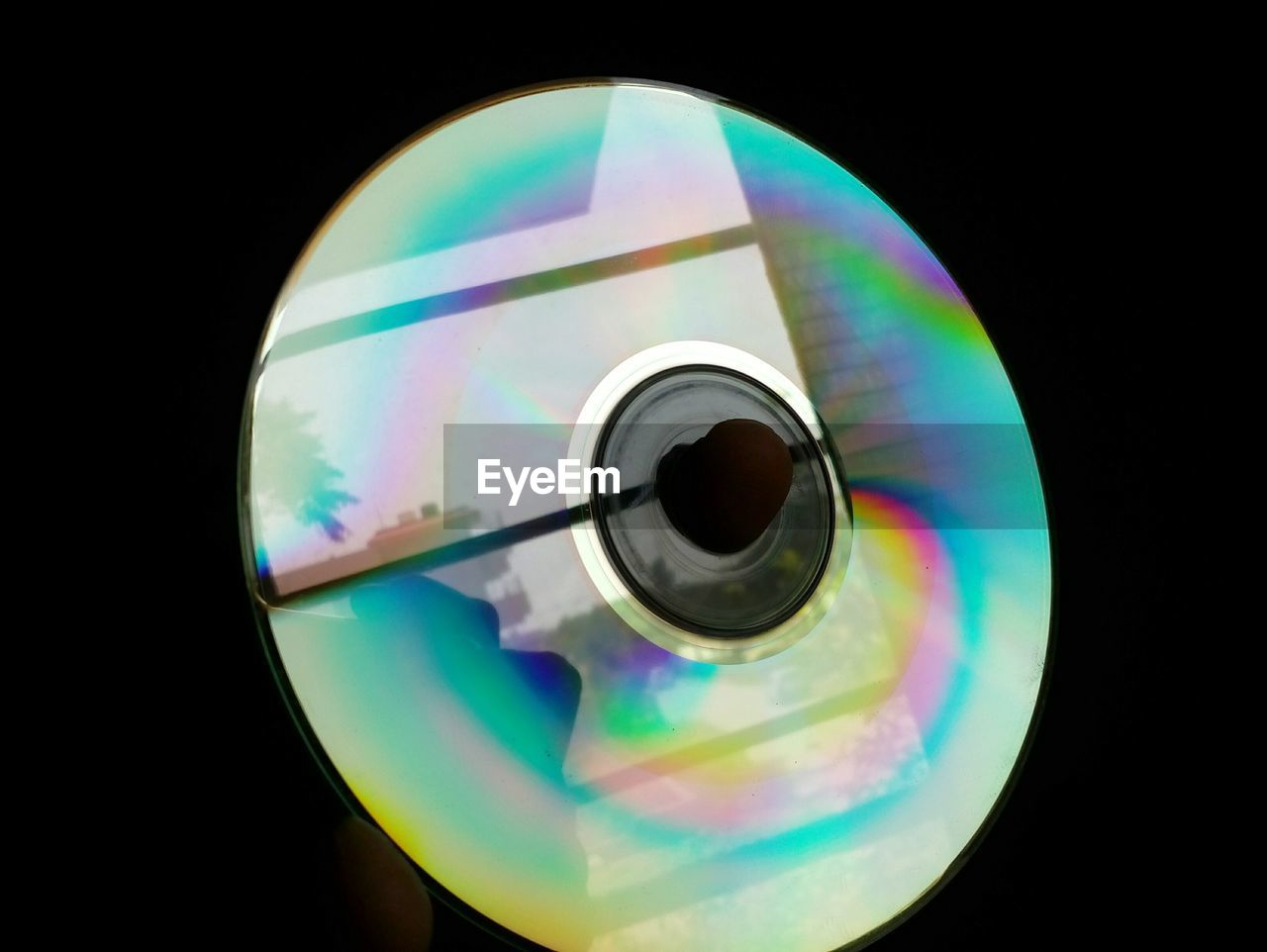 Close-up of hand holding disk