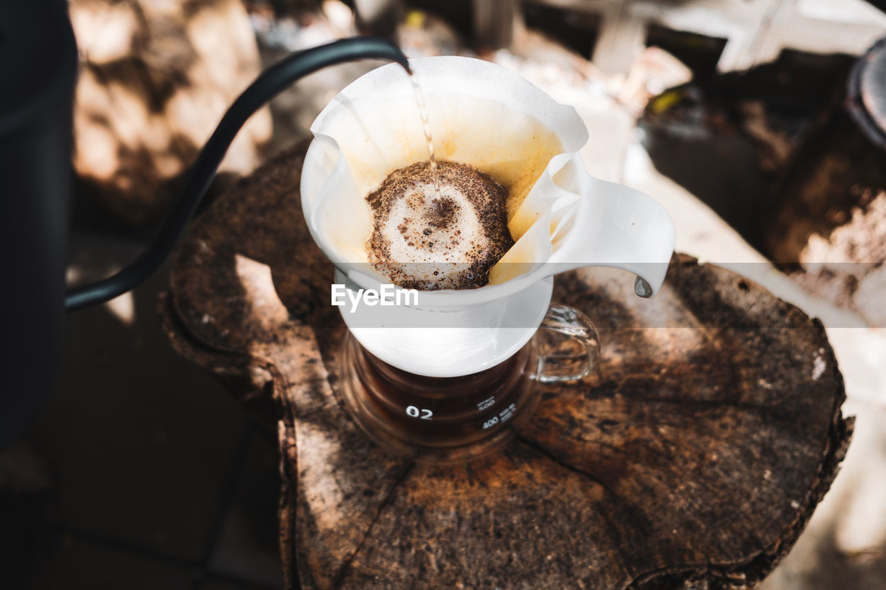 Barista dripping coffee and slow coffee bar style