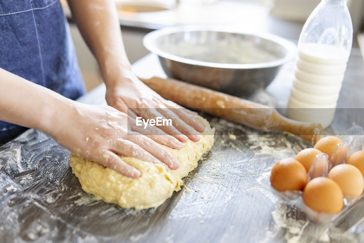 cropped hands of chef preparing food