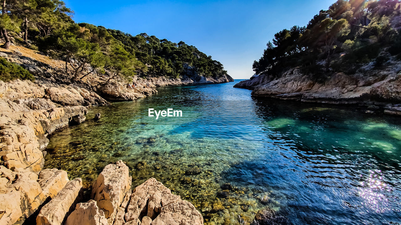 Scenic view of sea against blue sky