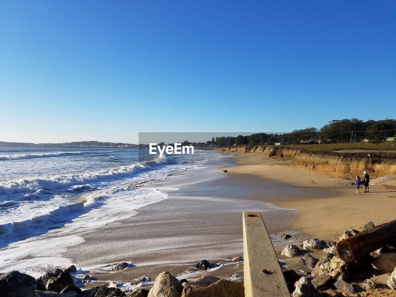 VIEW OF BEACH AGAINST CLEAR BLUE SKY